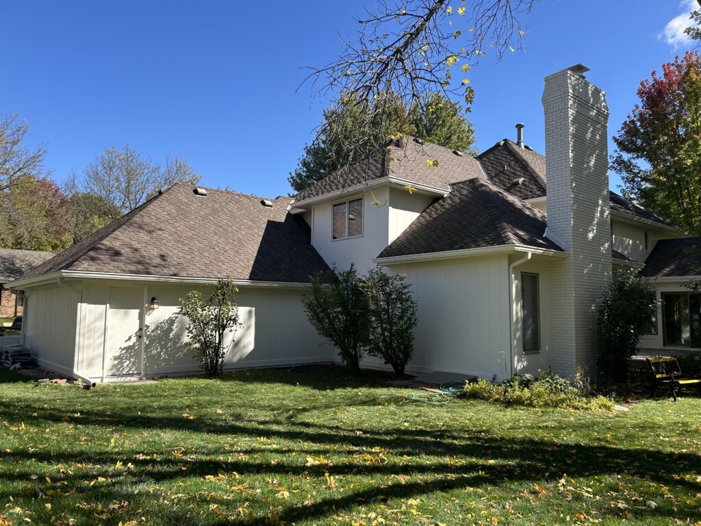 Older painted home exterior with siding, trim, and windows