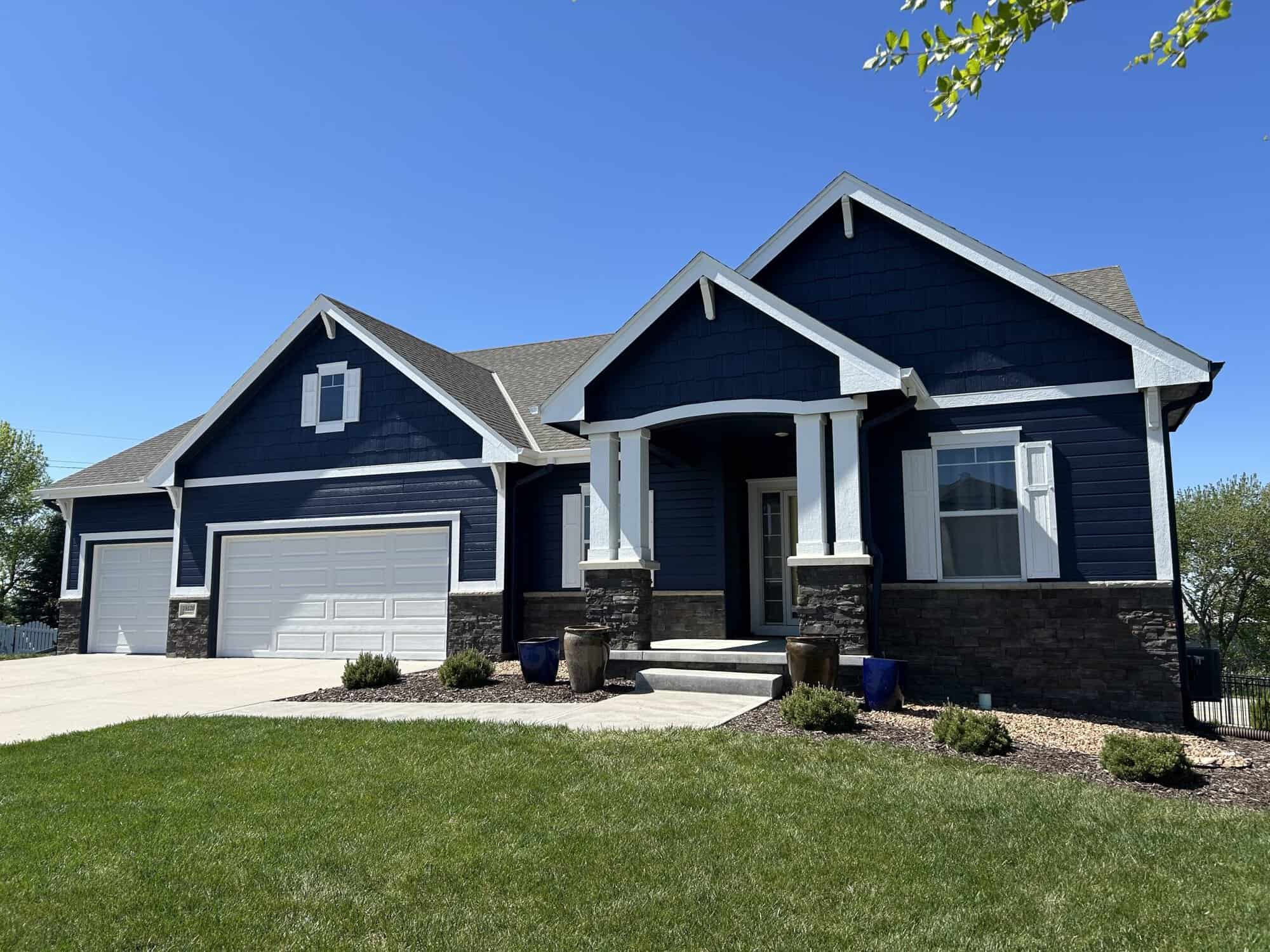 Exterior and Deck Painting with a Naval Blue Finish in Omaha, NE