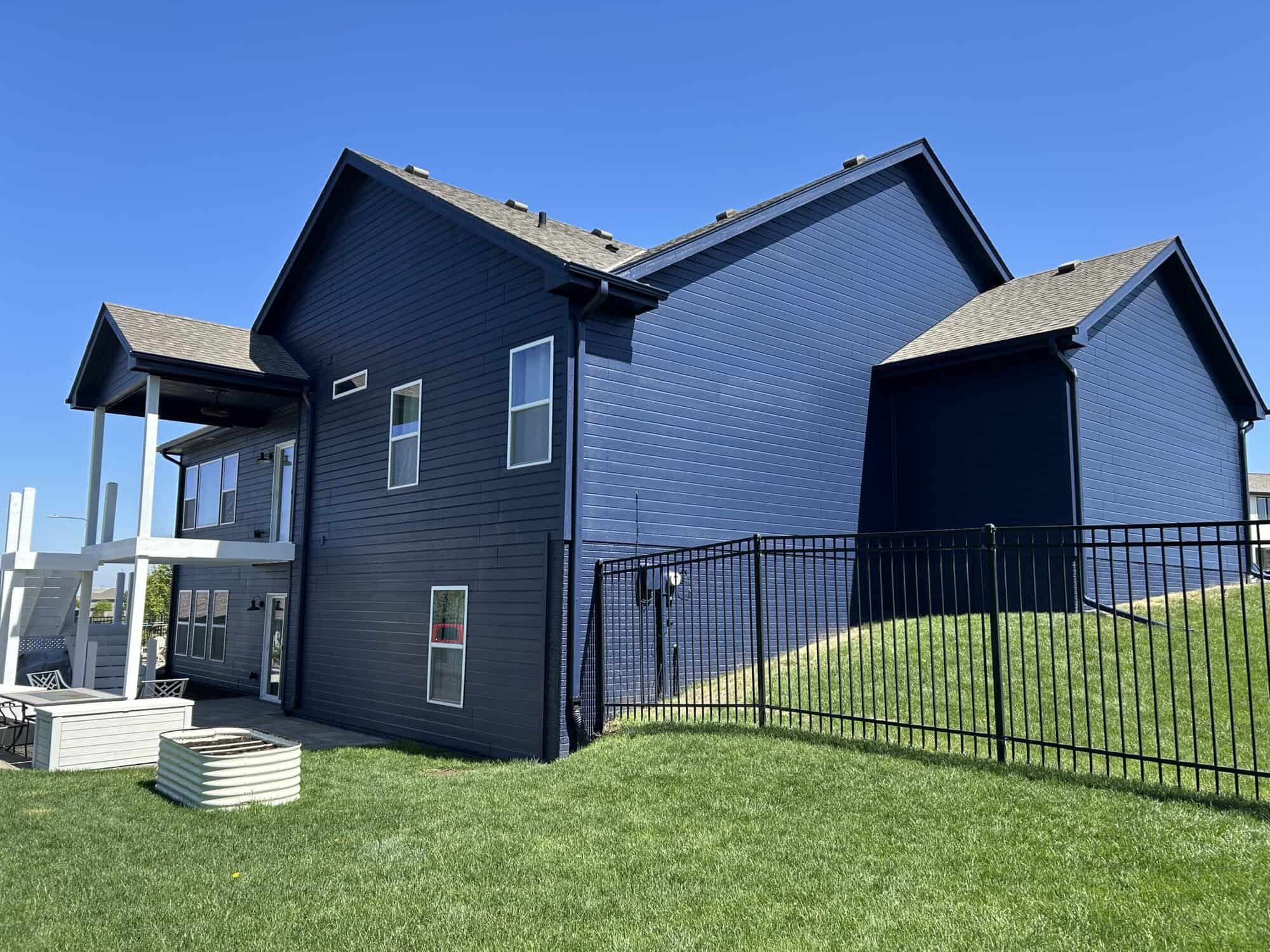 Exterior and Deck Painting with a Naval Blue Finish in Omaha, NE Exterior and Deck Painting with a Naval Blue Finish in Omaha, NE
